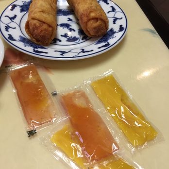 China Garden - egg rolls with four packets of sauce thrown on our table. - Chinese Near Me - North Charleston, South Carolina