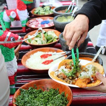 La Famosa Taquizas - Happy customers, loading up their plates! - Tacos Near Me La Famosa Taquizas - Happy customers, loading up their plates! - Tacos Near Me