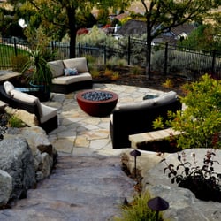 The Garden Artist, Inc. - A fire pit and cozy surroundings beckons visitors to the conversation area.