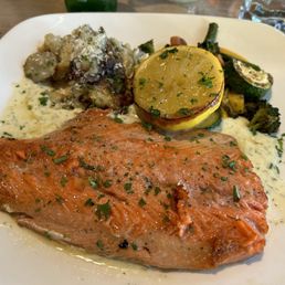 Grilled salmon with lemon dill sauce, scalloped potatoes, and vegetables Grilled salmon with lemon dill sauce, scalloped potatoes, and vegetables