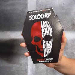 BoxLunch - Jolochip Last Chip Challenge, a single, jet-black tortilla chip known for its extreme heat.