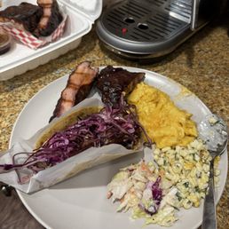 Pork rib, pulled pork taco, Mac and cheese, corn slaw, cole slaw