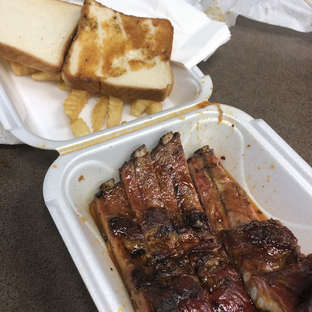 Rib Sandwich with a side of fries Rib Sandwich with a side of fries