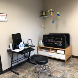 Pacific Medical Prosthetics and Orthotics - Head scanner and computer, with plenty of toys to distract the kids during the scan!