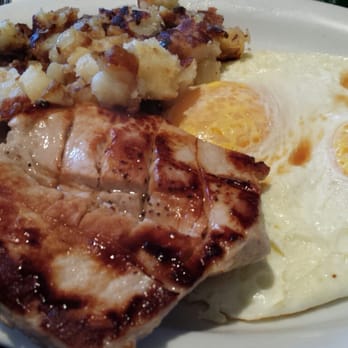 RJ's Cafe - Pork chop and 2 eggs over easy. Comes with potatoes and choice of toast. - Breakfast & Brunch Near Me - Dana Point, California RJ's Cafe - Pork chop and 2 eggs over easy. Comes with potatoes and choice of toast. - Breakfast & Brunch Near Me - Dana Point, California