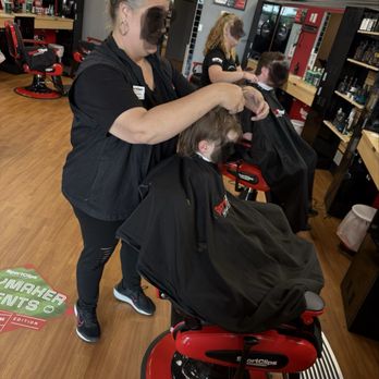Sport Clips - Courtney giving a hair cut. - Barbers Near Me - Aiken, South Carolina Sport Clips - Courtney giving a hair cut. - Barbers Near Me - Aiken, South Carolina