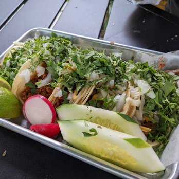 Taco Taxi - a tray of tacos, cucumbers, and radishes - Mexican Near Me - Pearl River, New York Taco Taxi - a tray of tacos, cucumbers, and radishes - Mexican Near Me - Pearl River, New York