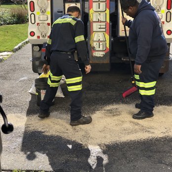 Bruneau's Garage - Second truck finally arrives to clean toxic hydraulic oil spillage from driveway. - Towing Near Me - West Haven, Connecticut