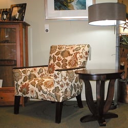 Pompanoosuc Mills - The Wentworth Armchair with the Goddard Oval End Table, all the wood is stained birch.