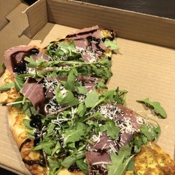 Valentino's Restaurant - The remainder of my arugula pizza. Entire pizza was cold!