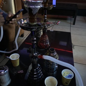 Reggae Hookah Lounge - a man smoking a hookah - Hookah Bars Near Me - Las Vegas, Nevada Reggae Hookah Lounge - a man smoking a hookah - Hookah Bars Near Me - Las Vegas, Nevada