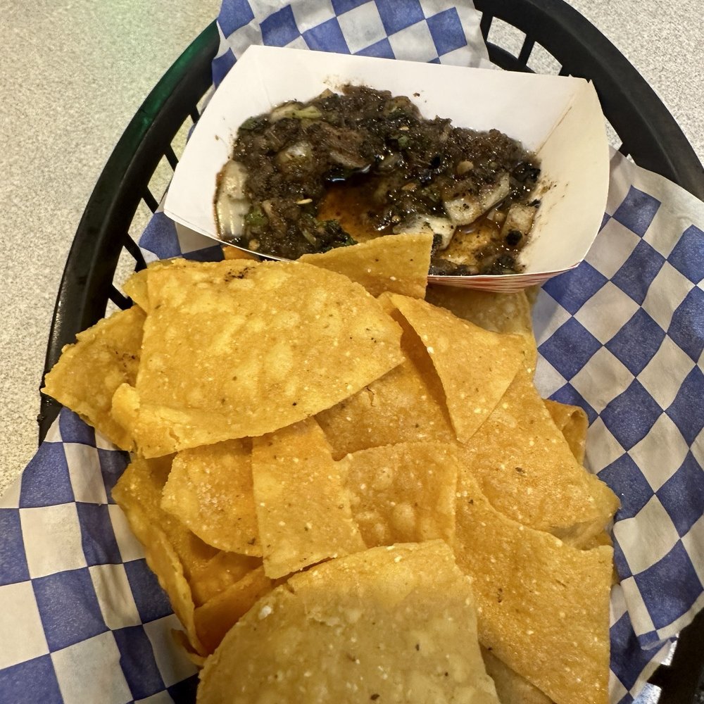 Chips and alittle spicy salsa Chips and alittle spicy salsa
