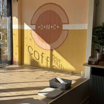 Our Mutual City Coffee - Sun through window with shadow of "coffee" below logo!! - Coffee & Tea Near Me - Chicago, Illinois Our Mutual City Coffee - Sun through window with shadow of "coffee" below logo!! - Coffee & Tea Near Me - Chicago, Illinois