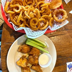 Wild Wing Cafe - 6 count nuggets flaming Parmesan dry rub with curly fries.