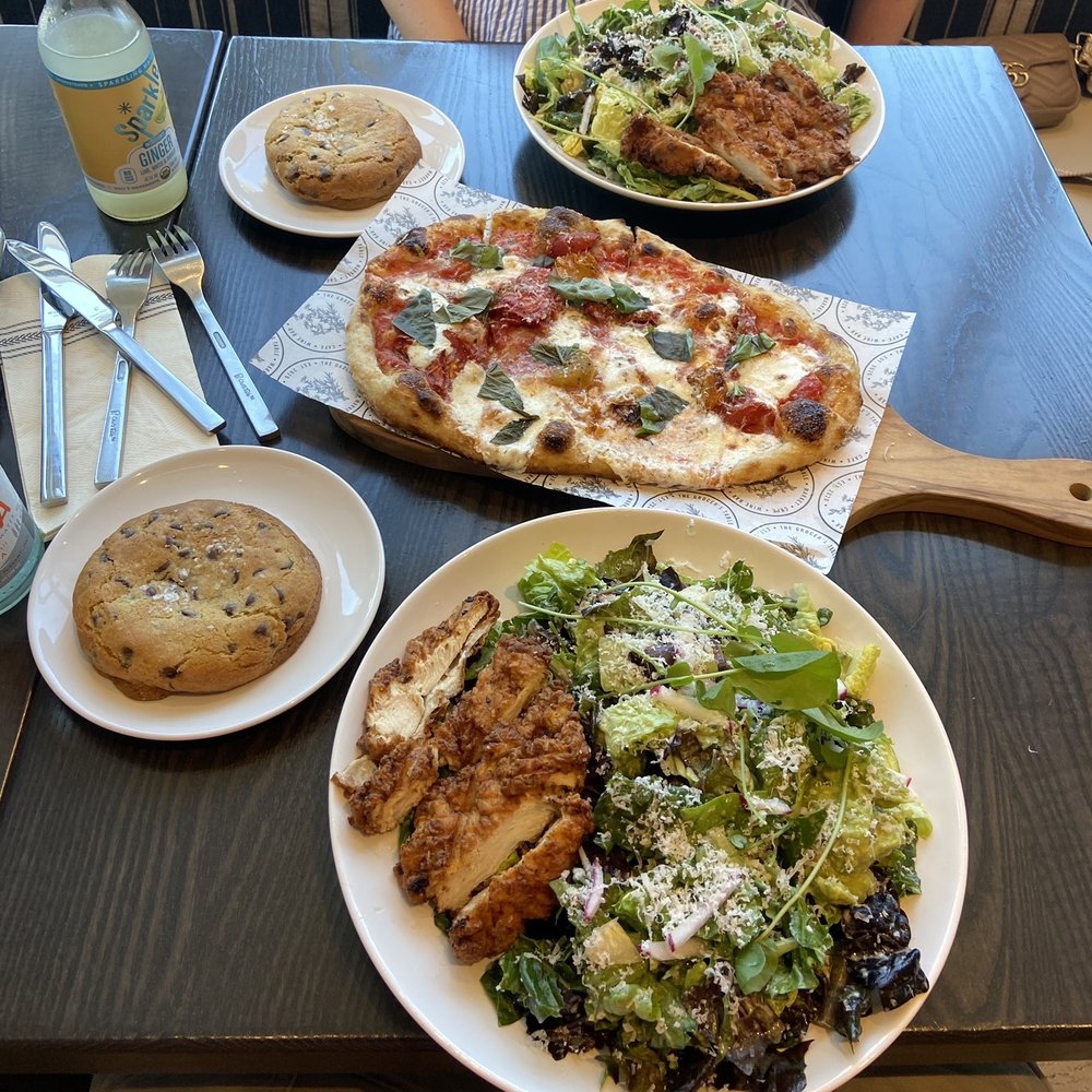 The Grocer's Table - crispy chicken green goddess salads with caesar dressing substituted, the margherita pizza, and their amazing chocolate chip cookies. - Cafes Near Me - Wayzata, Minnesota The Grocer's Table - crispy chicken green goddess salads with caesar dressing substituted, the margherita pizza, and their amazing chocolate chip cookies. - Cafes Near Me - Wayzata, Minnesota