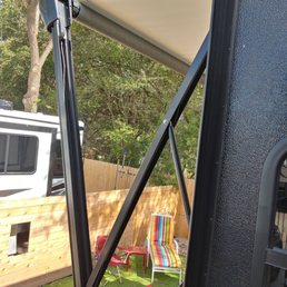 Awning will not retract after initial detention and no service offered after call to dealer.