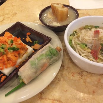 Kim Son - Clockwise from top: seafood conjee, a noodle soup with pork and shrimp, spring roll, and some type of flour dish. - Vietnamese Near Me - Houston, Texas Kim Son - Clockwise from top: seafood conjee, a noodle soup with pork and shrimp, spring roll, and some type of flour dish. - Vietnamese Near Me - Houston, Texas