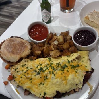 Coral Cafe - CDA Omelette w/ Potatoes and English muffin with huckleberry jam. - Breakfast & Brunch Near Me - Coeur d'Alene, Idaho Coral Cafe - CDA Omelette w/ Potatoes and English muffin with huckleberry jam. - Breakfast & Brunch Near Me - Coeur d'Alene, Idaho