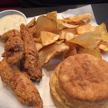 Angel Chicken Kitchen - The tenders are nicely breaded and the platter comes with a side of green chili gravy, house chips and a biscuit. - Chicken Shop Near Me - Dallas, Texas