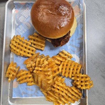 Atomic Wings - Wed Chicken Sandwich Combo with Jerk + splash of NuclearWaffle fries definitely frozen as some pieces were stuck together and undercooked. - Chicken Wings Near Me - Houston, Texas