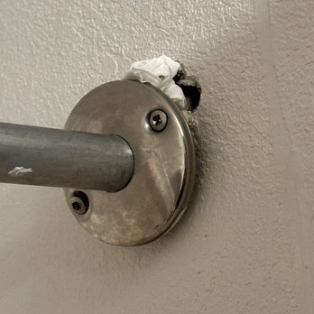 Super Inn & Suites - Shower rod hanging by one screw with trash stuffed in the hole - Hotels Near Me - Philadelphia, Mississippi Super Inn & Suites - Shower rod hanging by one screw with trash stuffed in the hole - Hotels Near Me - Philadelphia, Mississippi