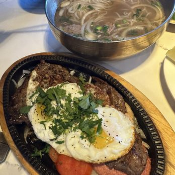 Pho Ga Bac Bac - BoNe (Hot stone plate combo with rib eye steak) and beef pho in the back. Both delicious - Vietnamese Near Me - Las Vegas, Nevada