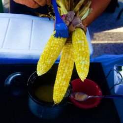 The Mighty Cob - A trio of Roasted Sweet Corn being buttered for business.