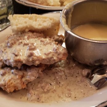 Jacob's Pickles - Sauage gravy with boneless chicken with biscuits and grits - Comfort Food Near Me - New York, New York Jacob's Pickles - Sauage gravy with boneless chicken with biscuits and grits - Comfort Food Near Me - New York, New York
