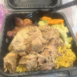 Arroz con gandules, pernil, plantains, and vegetables