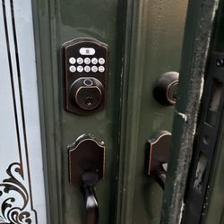 Simply The Best Home Improvement - bottom handle already lose- and old paint showing around the key pad and bottom handle