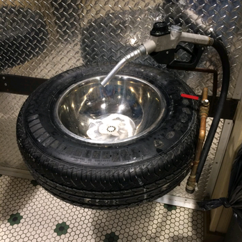 Ford's Garage - Sweet car themed tire sink + gas pump faucet at Fords Garage - Burgers Near Me - Brandon, Florida
