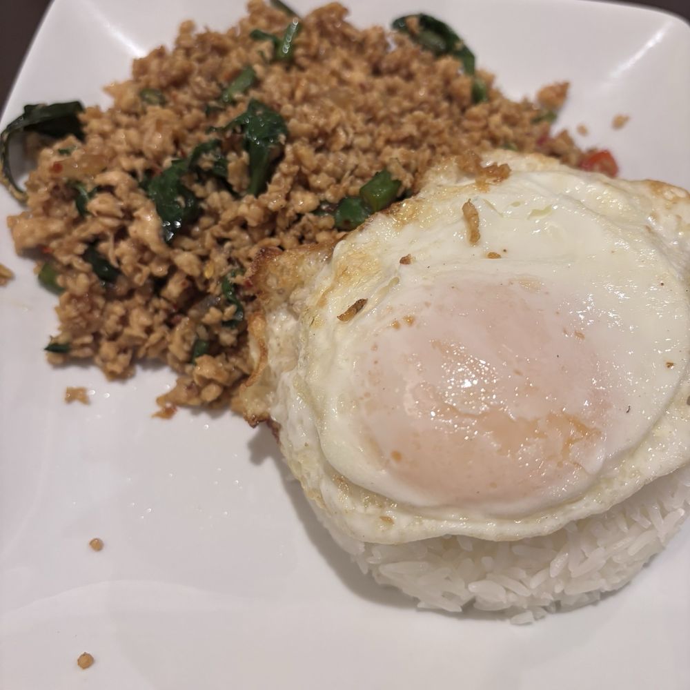 Lisu Thai Restaurant - Stir Fry Basil with egg on top of rice serves at #3 spice level - Thai Near Me - Bixby, Oklahoma Lisu Thai Restaurant - Stir Fry Basil with egg on top of rice serves at #3 spice level - Thai Near Me - Bixby, Oklahoma