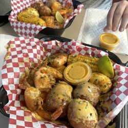 OMG Seafood - Shrimp lunch special for $11.99! Six large shrimp, several potatoes, hard boiled egg and corn with sauce and lime.