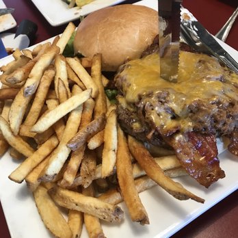 Taylor’s Tap and Grill - Tex Burger which comes with the burger, pulled pork on top, bacon, bbq sauce and cheese. Really good! - New American Near Me - Niagara Falls, New York
