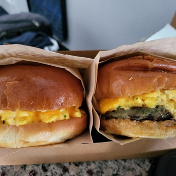 Eggslut - Fairfax sandwich, one with avocado, one with sausage - Breakfast & Brunch Near Me - Los Angeles, California