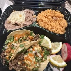 Birria Tacos El Mariachi - Spicy carne asada tacos with rice and beans
