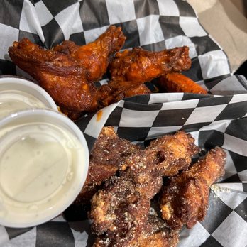 Fat Shack - a basket of chicken wings and dipping sauce - Burgers Near Me - San Marcos, Texas