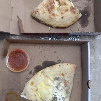 Johnny Brusco's New York Style Pizza - A comparison of the two calzones ordered.. the top one was cooked the second one was a wet dough ball. - Pizza Near Me - Trinity, Florida Johnny Brusco's New York Style Pizza - A comparison of the two calzones ordered.. the top one was cooked the second one was a wet dough ball. - Pizza Near Me - Trinity, Florida