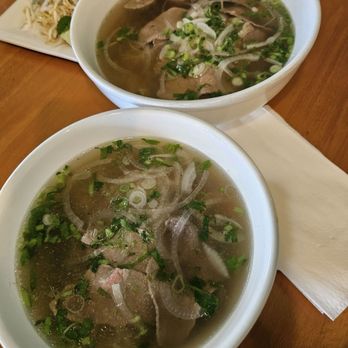 Pho Wagyu - Pho combination on top ($16.99), kids pho rare steak on the bottom ($13.99). - Vietnamese Near Me - Port St. Lucie, Florida