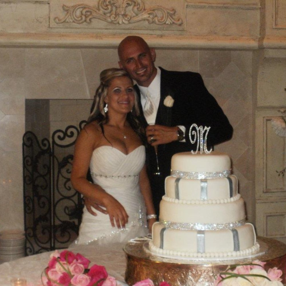 Sweet Occasions Bakery - a bride and groom cutting their wedding cake - Custom Cakes Near Me - Chalmette, Louisiana