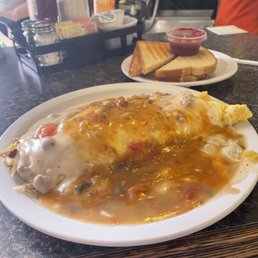 Sausage and gravy omelet with green chili on top