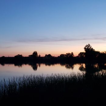 Thousand Trails Lake Minden - Sun going down behind the lake. Remember it's mosquito season. - Parks Near Me - Nicolaus, California Thousand Trails Lake Minden - Sun going down behind the lake. Remember it's mosquito season. - Parks Near Me - Nicolaus, California