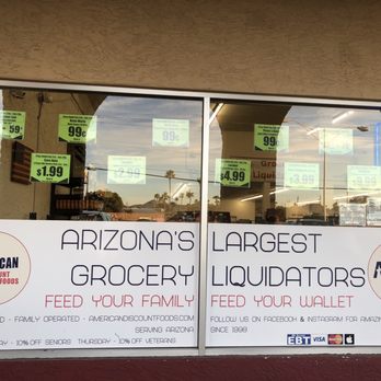 American Discount Foods - storefront window with signs - Grocery Near Me - Mesa, Arizona American Discount Foods - storefront window with signs - Grocery Near Me - Mesa, Arizona