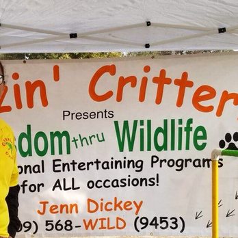 Cruzin' Critters - The critters and a volunteer at a festival. - Party & Event Planning Near Me Cruzin' Critters - The critters and a volunteer at a festival. - Party & Event Planning Near Me