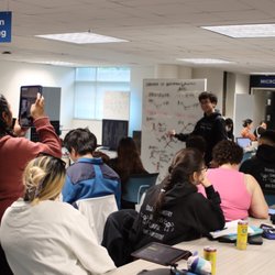BryantOchem Tutoring Services - Students working through Organic Chemistry problems together at the whiteboard.