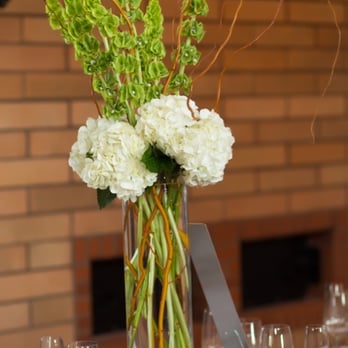Flowers by Kim - Centerpiece of white hydrangea, bells of Ireland, and curly willow. - Florists Near Me - Paso Robles, California