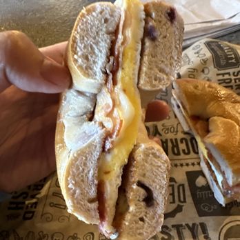 The Over Bite - a person holding a sandwich - Juice Bars & Smoothies Near Me - Monticello, Utah