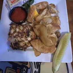Crab cake sandwich (without bun) and chips. The crab cake was dry tonight. We left some on the plate. The chips lacked flavor. Crab cake sandwich (without bun) and chips. The crab cake was dry tonight. We left some on the plate. The chips lacked flavor.