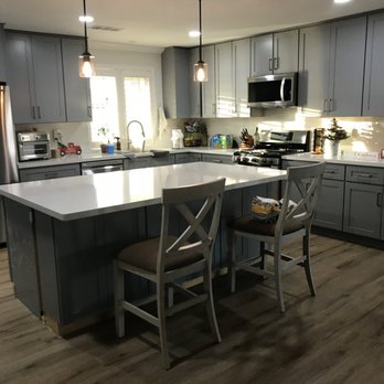 Alcon Construction - a kitchen with a center island - General Contractors Near Me