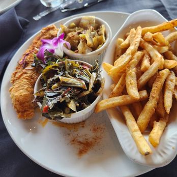 Noir Kitchen & Cocktails - Catfish with, Cajun cabbage, collard greens, and fries - Soul Food Near Me - Nashville, Tennessee